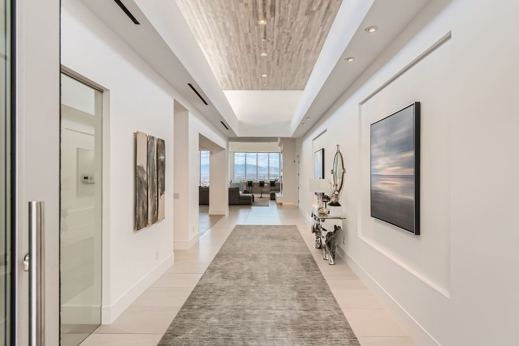 The Home in Henderson, a MacDonald Highlands residence offers a bright and open floor plan, an amazing backyard with infinity edge pool, spa, outdoor kitchen with bbq, fire pit and lounge area is now available for sale. This home located at 667 Palisade Rim Dr, Henderson, Nevada