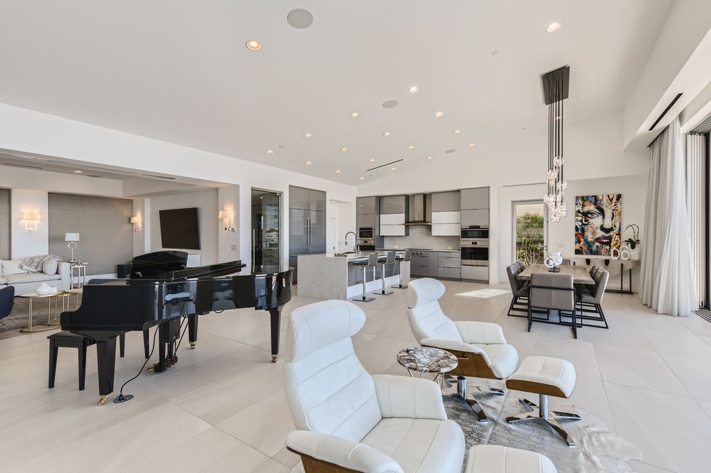 The Home in Henderson, a MacDonald Highlands residence offers a bright and open floor plan, an amazing backyard with infinity edge pool, spa, outdoor kitchen with bbq, fire pit and lounge area is now available for sale. This home located at 667 Palisade Rim Dr, Henderson, Nevada