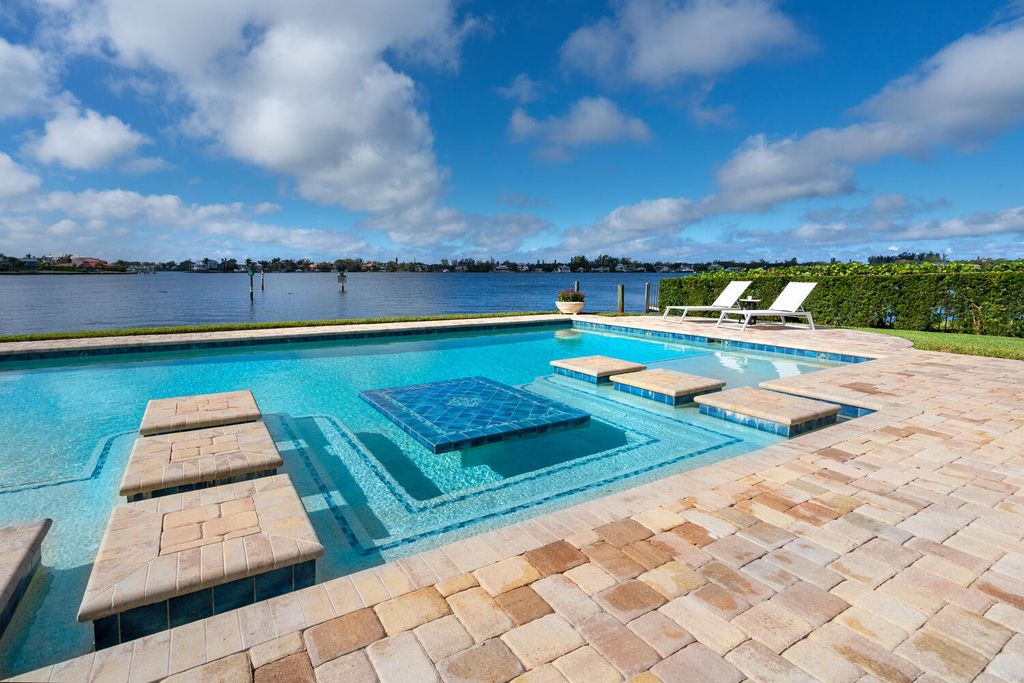 7350 Captain Kidd Ave, Sarasota, Florida is an amazing bay front estate accentuates a light and bright designer open floor plan which effortlessly blends architectural character with a modern look.