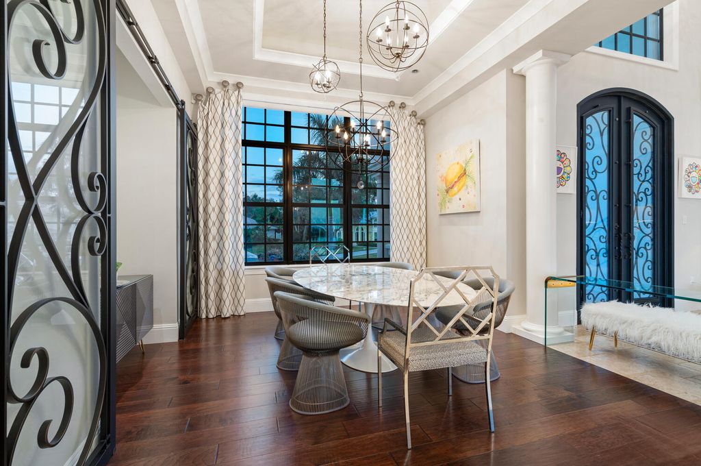 7350 Captain Kidd Ave, Sarasota, Florida is an amazing bay front estate accentuates a light and bright designer open floor plan which effortlessly blends architectural character with a modern look.