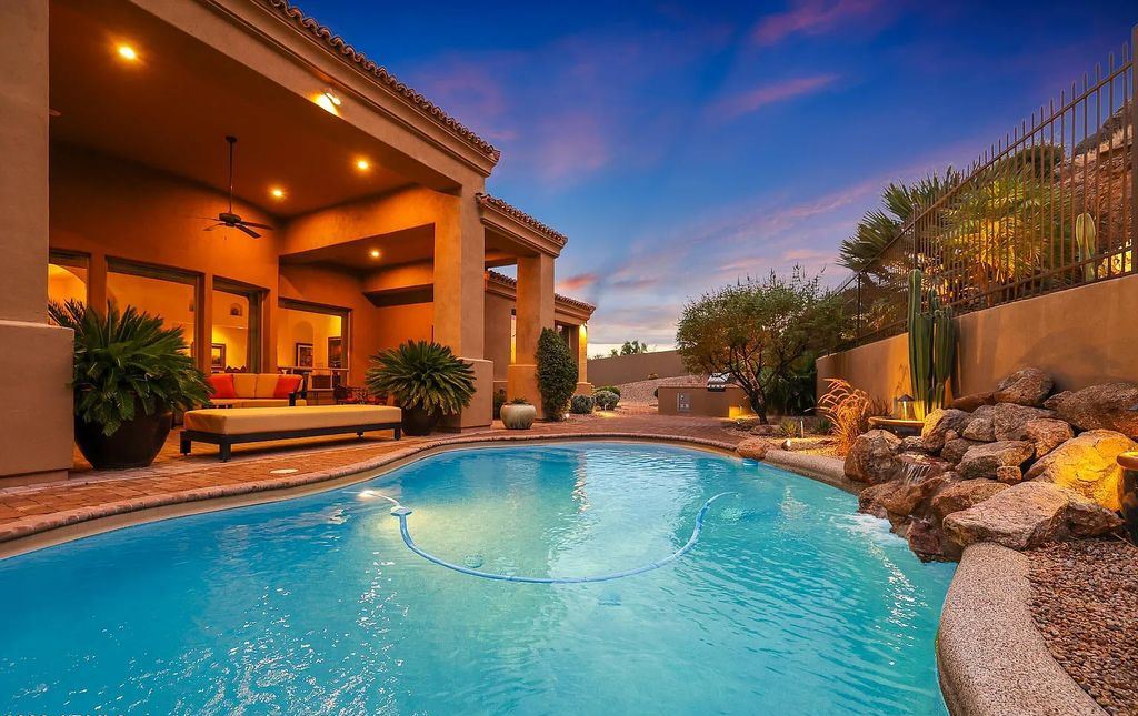 The Home in Scottsdale, a custom estate sitting on 2.78 acres in gated Sonoran Crest with details including box-beam, coffered and groin vault ceiling details, travertine stone flooring, granite counter surfaces, richly stained wood doors, trim, and cabinetry, a split floor plan and so much more is now available for sale. This home located at 24375 N 121st Pl, Scottsdale, Arizona