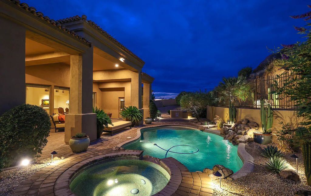 The Home in Scottsdale, a custom estate sitting on 2.78 acres in gated Sonoran Crest with details including box-beam, coffered and groin vault ceiling details, travertine stone flooring, granite counter surfaces, richly stained wood doors, trim, and cabinetry, a split floor plan and so much more is now available for sale. This home located at 24375 N 121st Pl, Scottsdale, Arizona