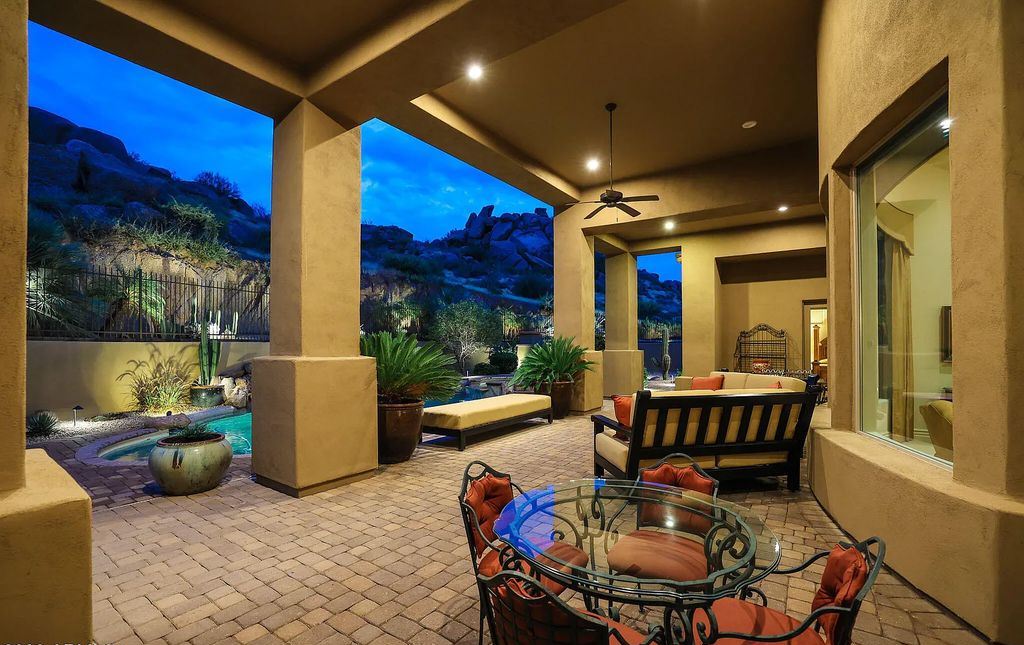 The Home in Scottsdale, a custom estate sitting on 2.78 acres in gated Sonoran Crest with details including box-beam, coffered and groin vault ceiling details, travertine stone flooring, granite counter surfaces, richly stained wood doors, trim, and cabinetry, a split floor plan and so much more is now available for sale. This home located at 24375 N 121st Pl, Scottsdale, Arizona