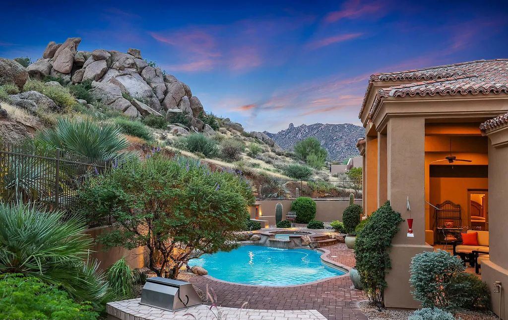 The Home in Scottsdale, a custom estate sitting on 2.78 acres in gated Sonoran Crest with details including box-beam, coffered and groin vault ceiling details, travertine stone flooring, granite counter surfaces, richly stained wood doors, trim, and cabinetry, a split floor plan and so much more is now available for sale. This home located at 24375 N 121st Pl, Scottsdale, Arizona