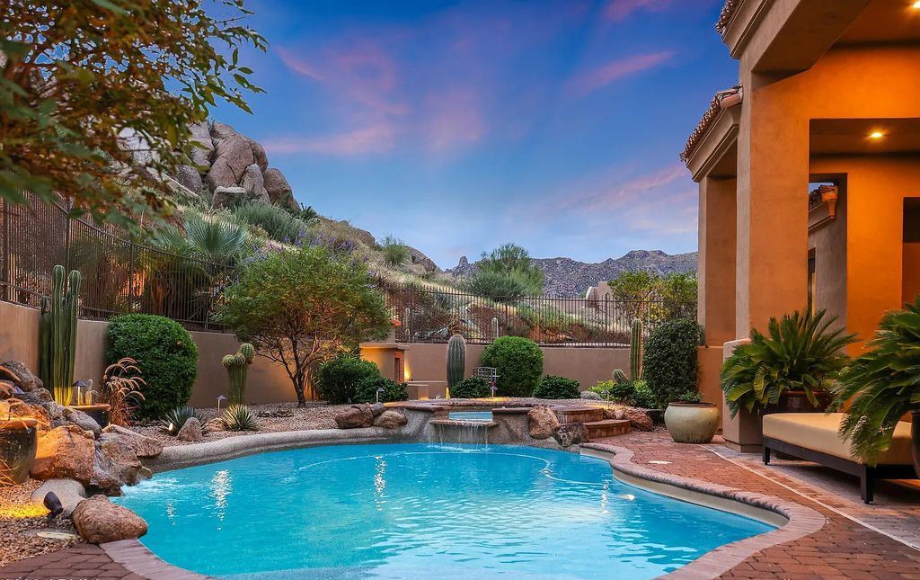The Home in Scottsdale, a custom estate sitting on 2.78 acres in gated Sonoran Crest with details including box-beam, coffered and groin vault ceiling details, travertine stone flooring, granite counter surfaces, richly stained wood doors, trim, and cabinetry, a split floor plan and so much more is now available for sale. This home located at 24375 N 121st Pl, Scottsdale, Arizona