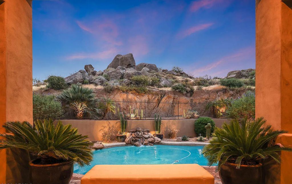 The Home in Scottsdale, a custom estate sitting on 2.78 acres in gated Sonoran Crest with details including box-beam, coffered and groin vault ceiling details, travertine stone flooring, granite counter surfaces, richly stained wood doors, trim, and cabinetry, a split floor plan and so much more is now available for sale. This home located at 24375 N 121st Pl, Scottsdale, Arizona