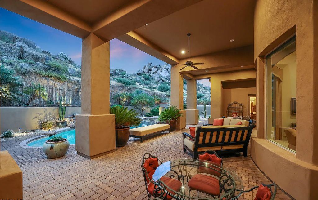 The Home in Scottsdale, a custom estate sitting on 2.78 acres in gated Sonoran Crest with details including box-beam, coffered and groin vault ceiling details, travertine stone flooring, granite counter surfaces, richly stained wood doors, trim, and cabinetry, a split floor plan and so much more is now available for sale. This home located at 24375 N 121st Pl, Scottsdale, Arizona