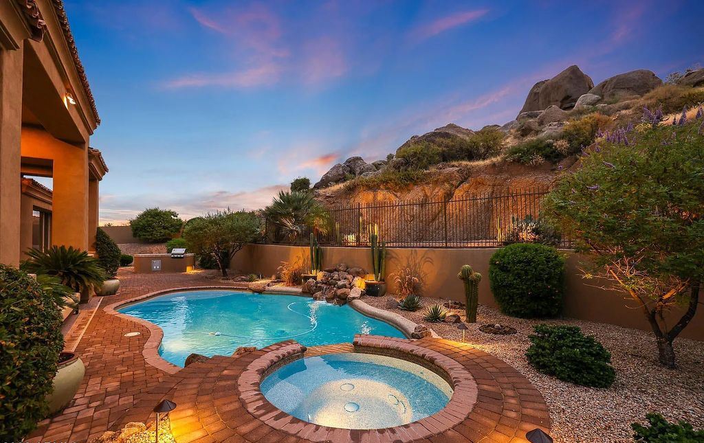 The Home in Scottsdale, a custom estate sitting on 2.78 acres in gated Sonoran Crest with details including box-beam, coffered and groin vault ceiling details, travertine stone flooring, granite counter surfaces, richly stained wood doors, trim, and cabinetry, a split floor plan and so much more is now available for sale. This home located at 24375 N 121st Pl, Scottsdale, Arizona