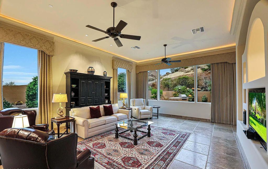 The Home in Scottsdale, a custom estate sitting on 2.78 acres in gated Sonoran Crest with details including box-beam, coffered and groin vault ceiling details, travertine stone flooring, granite counter surfaces, richly stained wood doors, trim, and cabinetry, a split floor plan and so much more is now available for sale. This home located at 24375 N 121st Pl, Scottsdale, Arizona