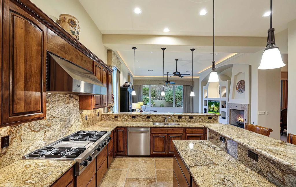 The Home in Scottsdale, a custom estate sitting on 2.78 acres in gated Sonoran Crest with details including box-beam, coffered and groin vault ceiling details, travertine stone flooring, granite counter surfaces, richly stained wood doors, trim, and cabinetry, a split floor plan and so much more is now available for sale. This home located at 24375 N 121st Pl, Scottsdale, Arizona