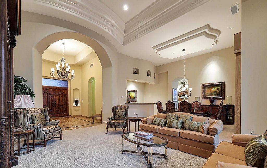 The Home in Scottsdale, a custom estate sitting on 2.78 acres in gated Sonoran Crest with details including box-beam, coffered and groin vault ceiling details, travertine stone flooring, granite counter surfaces, richly stained wood doors, trim, and cabinetry, a split floor plan and so much more is now available for sale. This home located at 24375 N 121st Pl, Scottsdale, Arizona