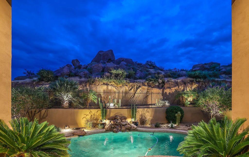 The Home in Scottsdale, a custom estate sitting on 2.78 acres in gated Sonoran Crest with details including box-beam, coffered and groin vault ceiling details, travertine stone flooring, granite counter surfaces, richly stained wood doors, trim, and cabinetry, a split floor plan and so much more is now available for sale. This home located at 24375 N 121st Pl, Scottsdale, Arizona