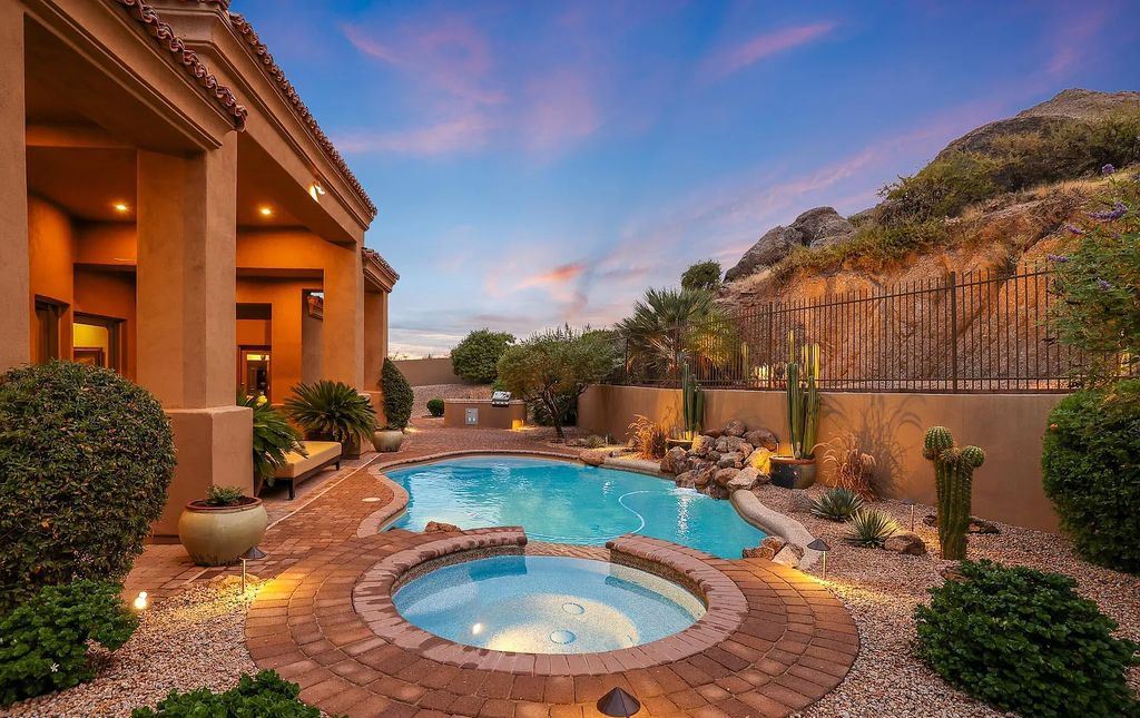 The Home in Scottsdale, a custom estate sitting on 2.78 acres in gated Sonoran Crest with details including box-beam, coffered and groin vault ceiling details, travertine stone flooring, granite counter surfaces, richly stained wood doors, trim, and cabinetry, a split floor plan and so much more is now available for sale. This home located at 24375 N 121st Pl, Scottsdale, Arizona