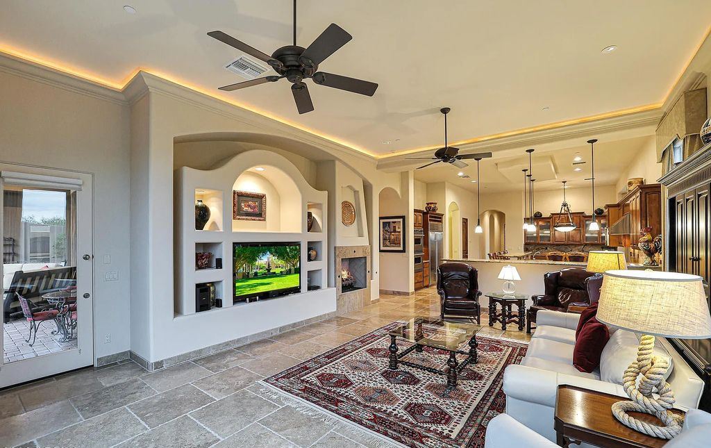 The Home in Scottsdale, a custom estate sitting on 2.78 acres in gated Sonoran Crest with details including box-beam, coffered and groin vault ceiling details, travertine stone flooring, granite counter surfaces, richly stained wood doors, trim, and cabinetry, a split floor plan and so much more is now available for sale. This home located at 24375 N 121st Pl, Scottsdale, Arizona