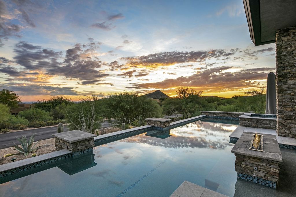 The Home in Scottsdale, a stunning desert contemporary estate which all on one level with open, airy and inviting floor plan encourages the seamless indoor outdoor living experience that is so unique to Arizona  is now available for sale. This home located at 39813 N 103rd Way, Scottsdale, Arizona