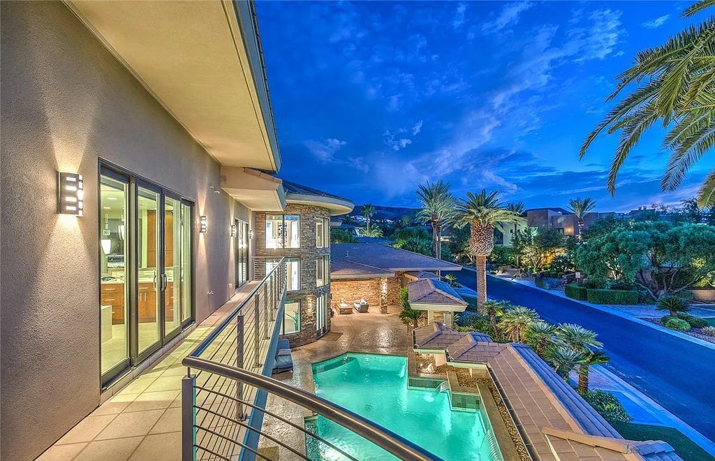 The Home in Henderson, an entirely custom & contemporary home offers views from every room, private courtyard with pool, spa, outdoor kitchen, fire pit and built-in BBQ, dual living rooms with fireplaces, motorized shades is now available for sale. This home located at 580 Saint Croix St, Henderson, Nevada