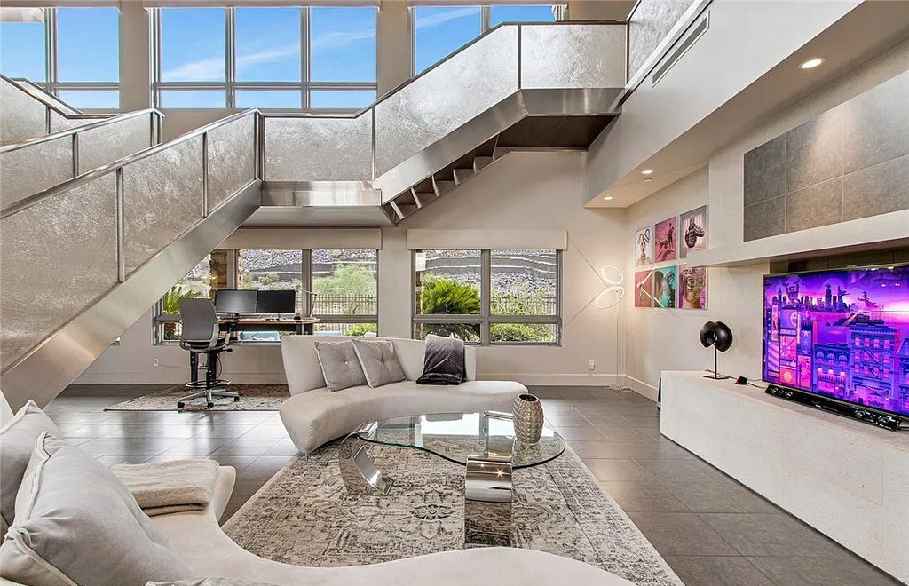 The Home in Henderson, an entirely custom & contemporary home offers views from every room, private courtyard with pool, spa, outdoor kitchen, fire pit and built-in BBQ, dual living rooms with fireplaces, motorized shades is now available for sale. This home located at 580 Saint Croix St, Henderson, Nevada