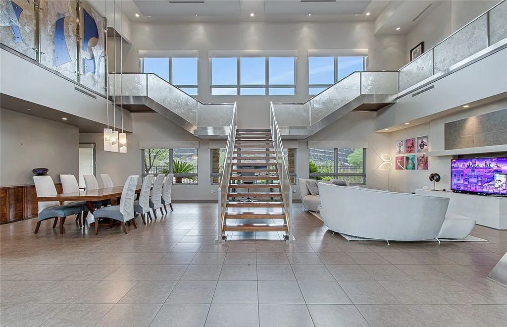 The Home in Henderson, an entirely custom & contemporary home offers views from every room, private courtyard with pool, spa, outdoor kitchen, fire pit and built-in BBQ, dual living rooms with fireplaces, motorized shades is now available for sale. This home located at 580 Saint Croix St, Henderson, Nevada