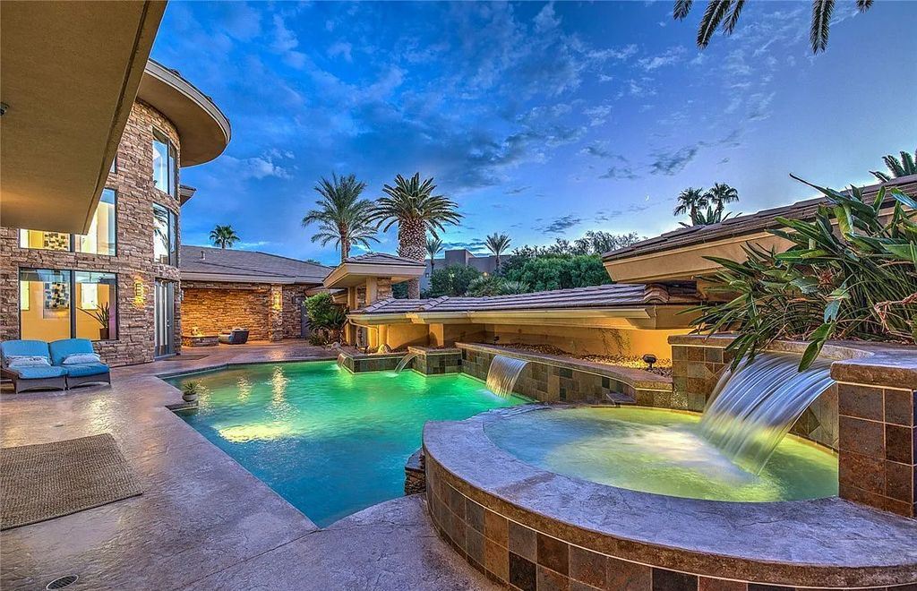 The Home in Henderson, an entirely custom & contemporary home offers views from every room, private courtyard with pool, spa, outdoor kitchen, fire pit and built-in BBQ, dual living rooms with fireplaces, motorized shades is now available for sale. This home located at 580 Saint Croix St, Henderson, Nevada