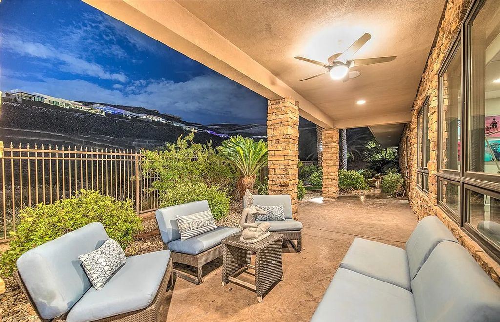 The Home in Henderson, an entirely custom & contemporary home offers views from every room, private courtyard with pool, spa, outdoor kitchen, fire pit and built-in BBQ, dual living rooms with fireplaces, motorized shades is now available for sale. This home located at 580 Saint Croix St, Henderson, Nevada