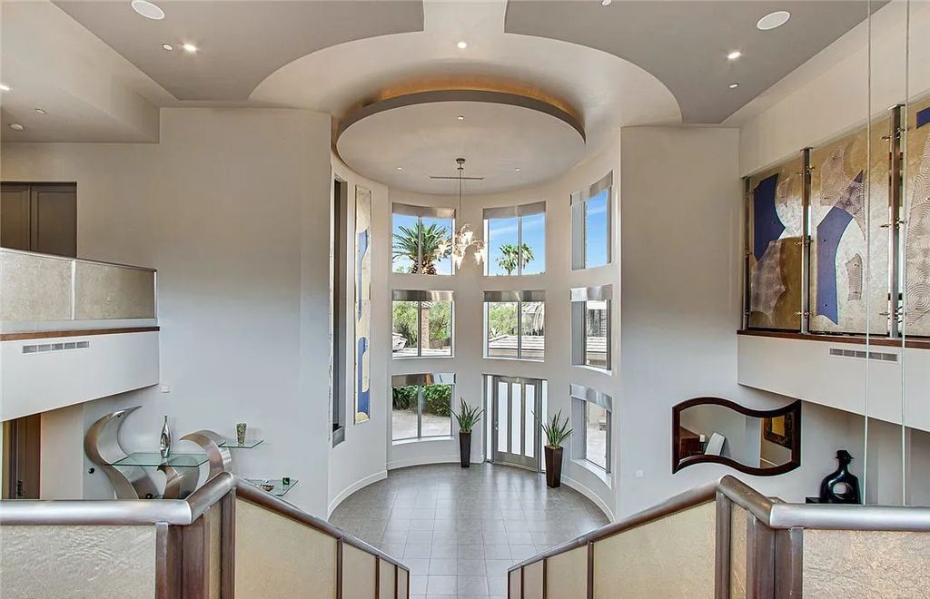 The Home in Henderson, an entirely custom & contemporary home offers views from every room, private courtyard with pool, spa, outdoor kitchen, fire pit and built-in BBQ, dual living rooms with fireplaces, motorized shades is now available for sale. This home located at 580 Saint Croix St, Henderson, Nevada