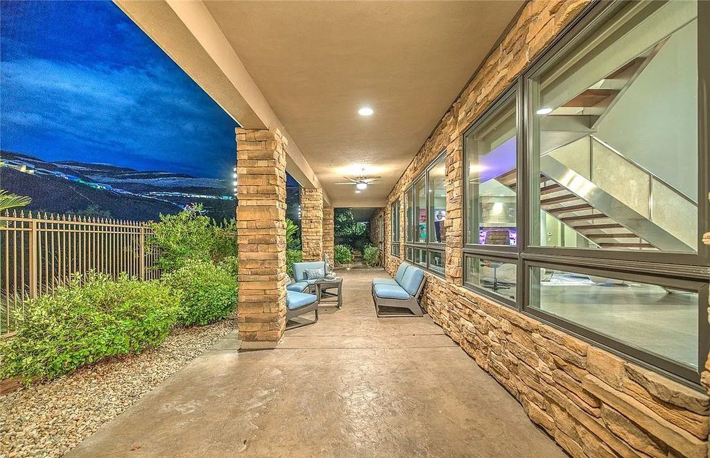 The Home in Henderson, an entirely custom & contemporary home offers views from every room, private courtyard with pool, spa, outdoor kitchen, fire pit and built-in BBQ, dual living rooms with fireplaces, motorized shades is now available for sale. This home located at 580 Saint Croix St, Henderson, Nevada