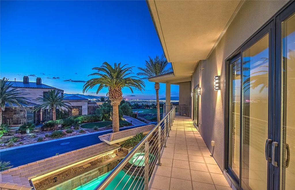 The Home in Henderson, an entirely custom & contemporary home offers views from every room, private courtyard with pool, spa, outdoor kitchen, fire pit and built-in BBQ, dual living rooms with fireplaces, motorized shades is now available for sale. This home located at 580 Saint Croix St, Henderson, Nevada