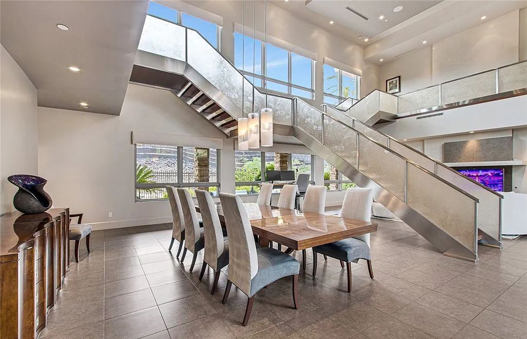The Home in Henderson, an entirely custom & contemporary home offers views from every room, private courtyard with pool, spa, outdoor kitchen, fire pit and built-in BBQ, dual living rooms with fireplaces, motorized shades is now available for sale. This home located at 580 Saint Croix St, Henderson, Nevada