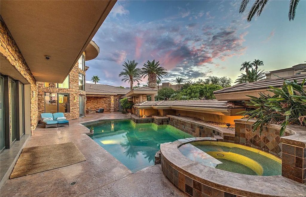 The Home in Henderson, an entirely custom & contemporary home offers views from every room, private courtyard with pool, spa, outdoor kitchen, fire pit and built-in BBQ, dual living rooms with fireplaces, motorized shades is now available for sale. This home located at 580 Saint Croix St, Henderson, Nevada