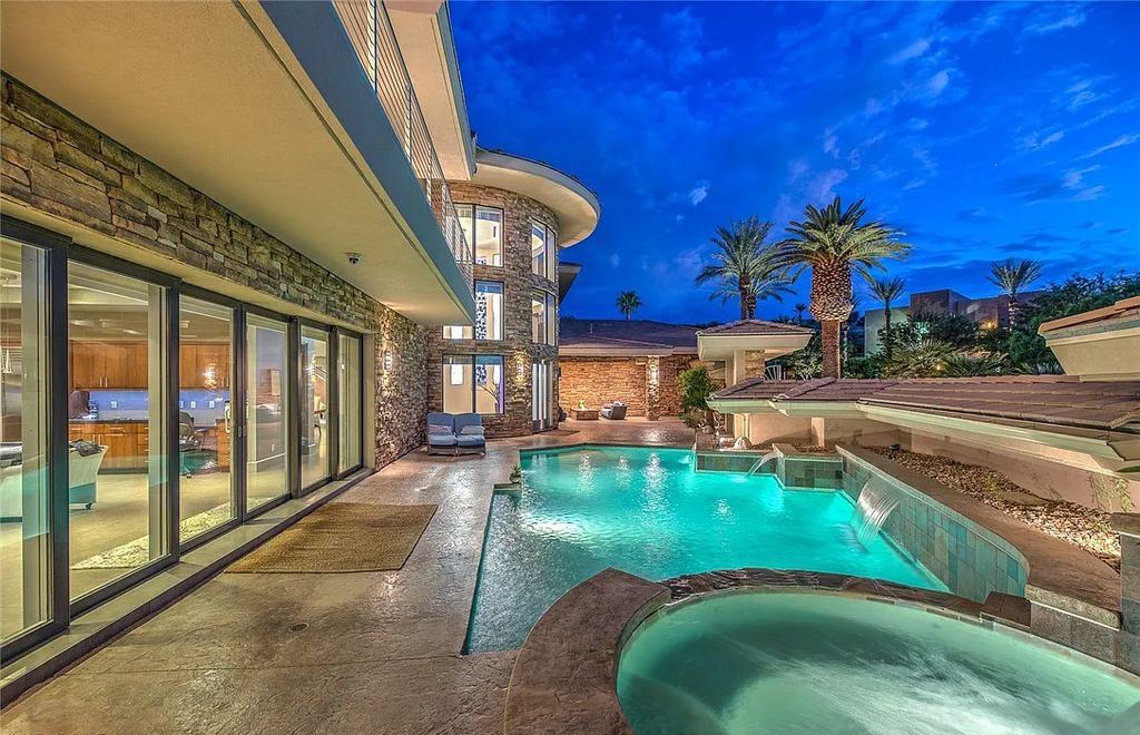 The Home in Henderson, an entirely custom & contemporary home offers views from every room, private courtyard with pool, spa, outdoor kitchen, fire pit and built-in BBQ, dual living rooms with fireplaces, motorized shades is now available for sale. This home located at 580 Saint Croix St, Henderson, Nevada
