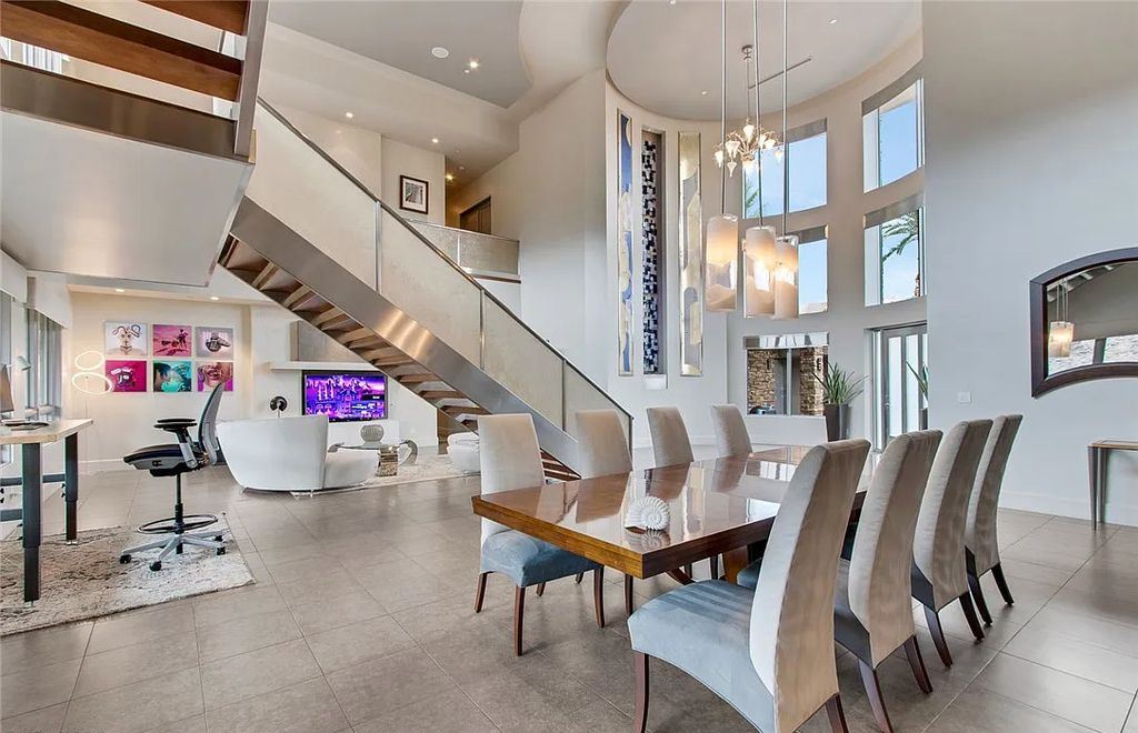 The Home in Henderson, an entirely custom & contemporary home offers views from every room, private courtyard with pool, spa, outdoor kitchen, fire pit and built-in BBQ, dual living rooms with fireplaces, motorized shades is now available for sale. This home located at 580 Saint Croix St, Henderson, Nevada