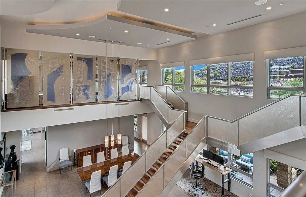 The Home in Henderson, an entirely custom & contemporary home offers views from every room, private courtyard with pool, spa, outdoor kitchen, fire pit and built-in BBQ, dual living rooms with fireplaces, motorized shades is now available for sale. This home located at 580 Saint Croix St, Henderson, Nevada
