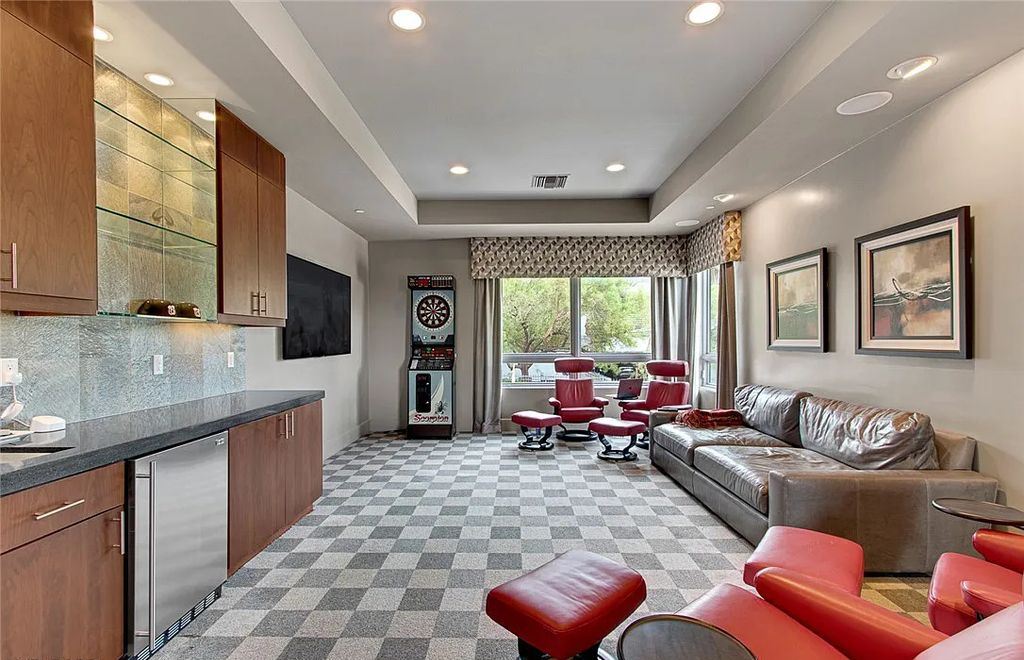 The Home in Henderson, an entirely custom & contemporary home offers views from every room, private courtyard with pool, spa, outdoor kitchen, fire pit and built-in BBQ, dual living rooms with fireplaces, motorized shades is now available for sale. This home located at 580 Saint Croix St, Henderson, Nevada