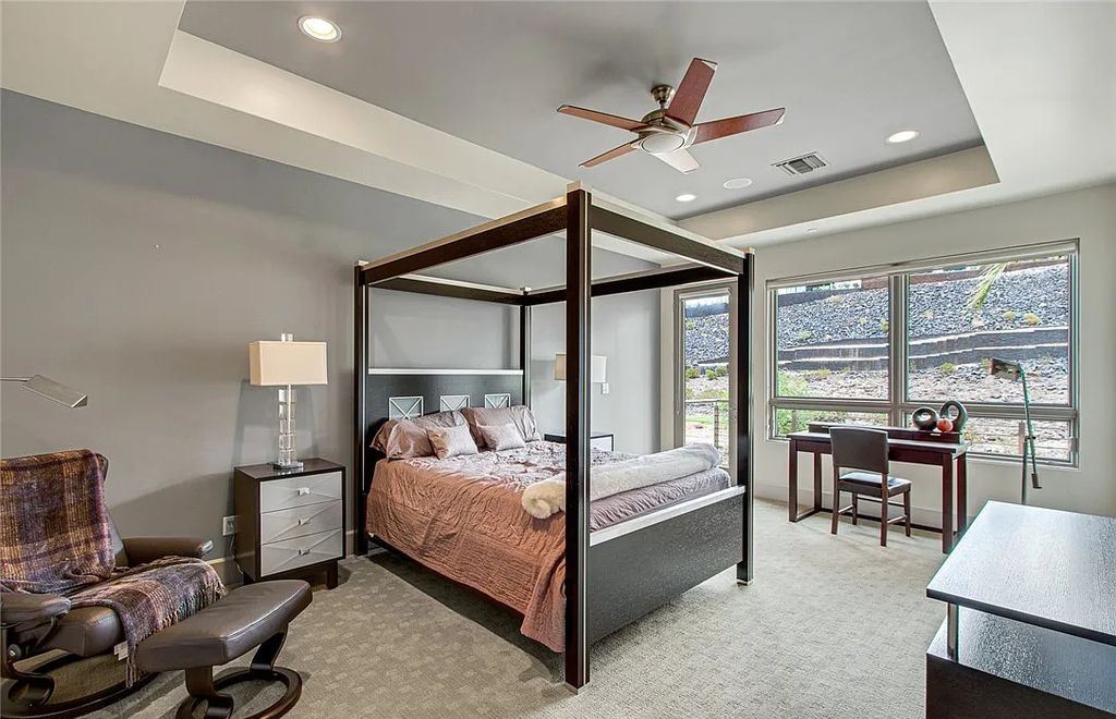 The Home in Henderson, an entirely custom & contemporary home offers views from every room, private courtyard with pool, spa, outdoor kitchen, fire pit and built-in BBQ, dual living rooms with fireplaces, motorized shades is now available for sale. This home located at 580 Saint Croix St, Henderson, Nevada