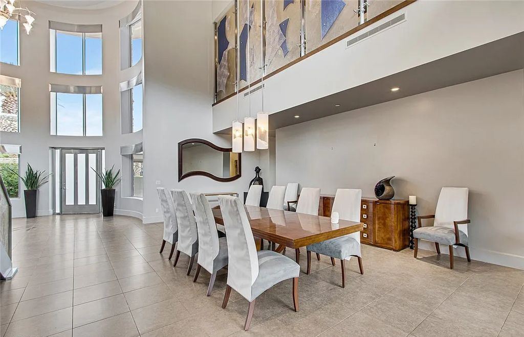 The Home in Henderson, an entirely custom & contemporary home offers views from every room, private courtyard with pool, spa, outdoor kitchen, fire pit and built-in BBQ, dual living rooms with fireplaces, motorized shades is now available for sale. This home located at 580 Saint Croix St, Henderson, Nevada