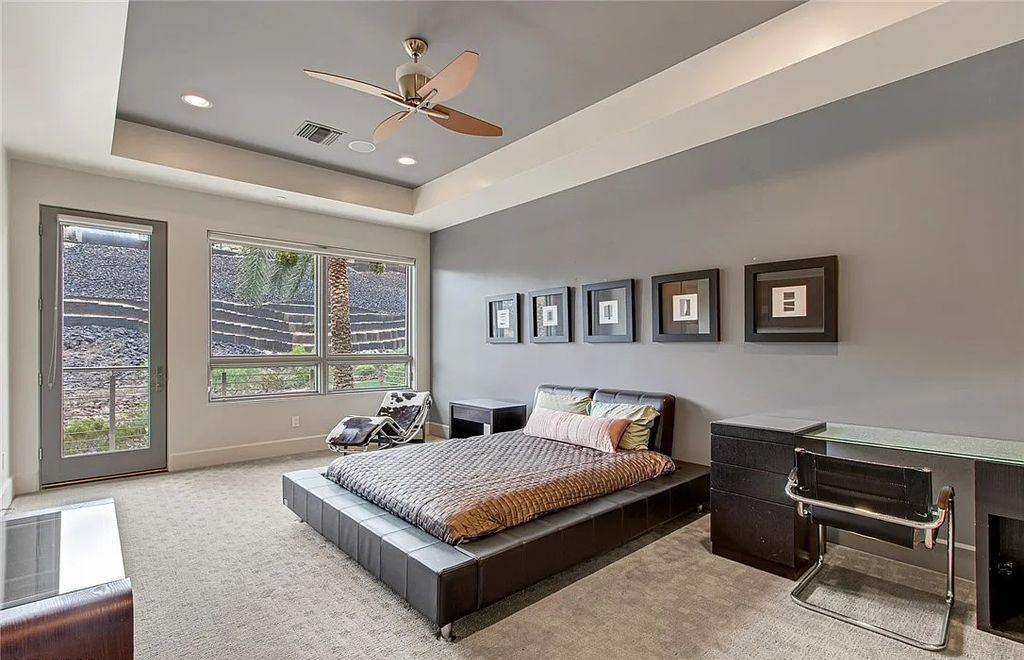 The Home in Henderson, an entirely custom & contemporary home offers views from every room, private courtyard with pool, spa, outdoor kitchen, fire pit and built-in BBQ, dual living rooms with fireplaces, motorized shades is now available for sale. This home located at 580 Saint Croix St, Henderson, Nevada