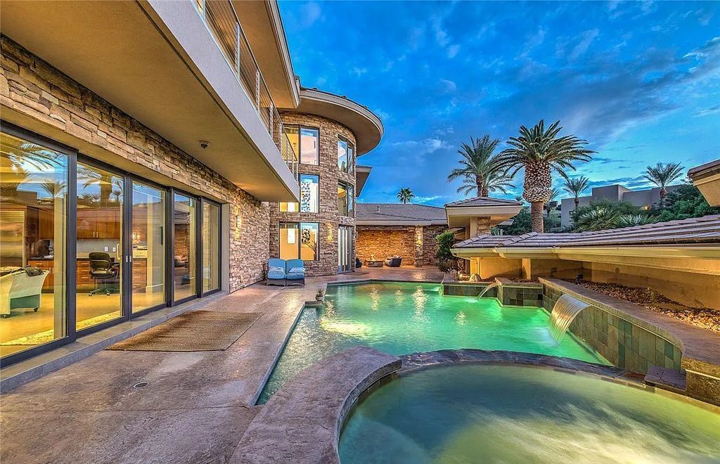 The Home in Henderson, an entirely custom & contemporary home offers views from every room, private courtyard with pool, spa, outdoor kitchen, fire pit and built-in BBQ, dual living rooms with fireplaces, motorized shades is now available for sale. This home located at 580 Saint Croix St, Henderson, Nevada