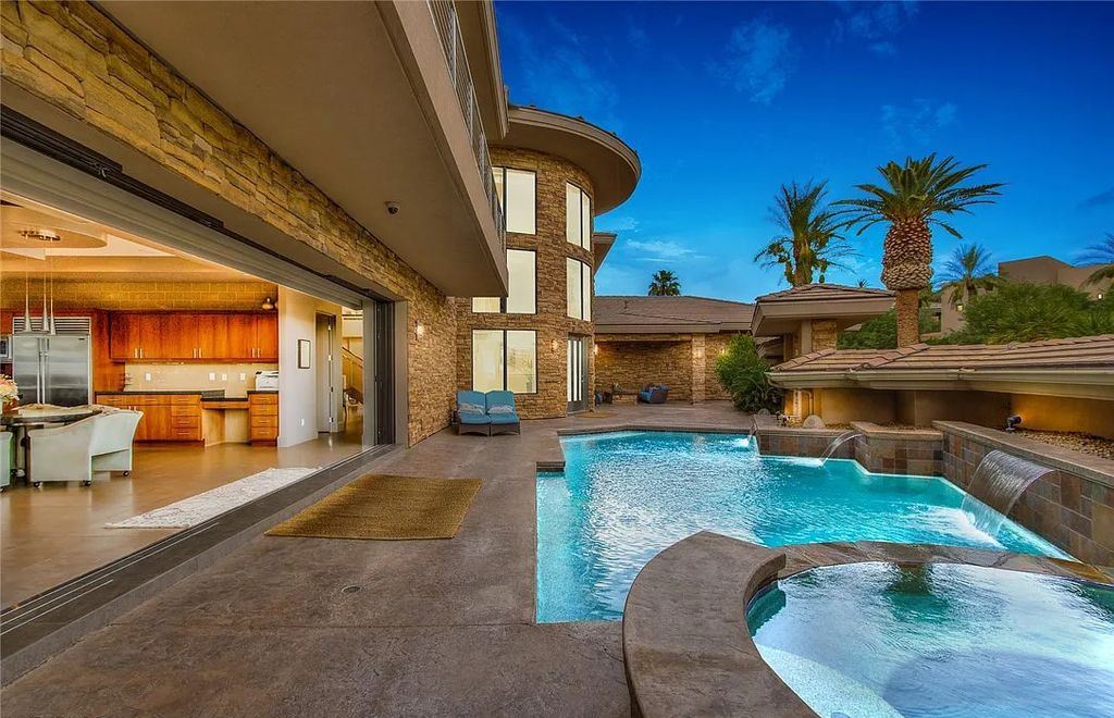 The Home in Henderson, an entirely custom & contemporary home offers views from every room, private courtyard with pool, spa, outdoor kitchen, fire pit and built-in BBQ, dual living rooms with fireplaces, motorized shades is now available for sale. This home located at 580 Saint Croix St, Henderson, Nevada