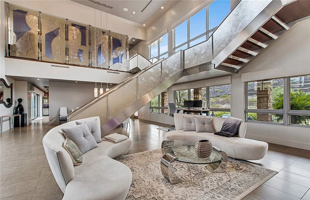 The Home in Henderson, an entirely custom & contemporary home offers views from every room, private courtyard with pool, spa, outdoor kitchen, fire pit and built-in BBQ, dual living rooms with fireplaces, motorized shades is now available for sale. This home located at 580 Saint Croix St, Henderson, Nevada