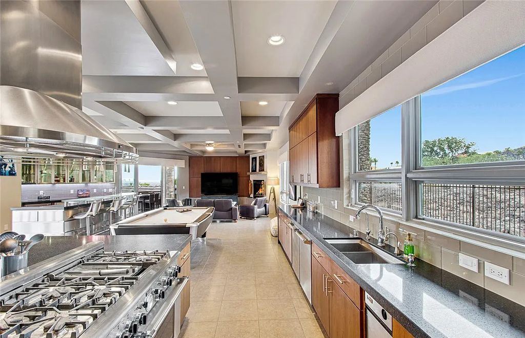 The Home in Henderson, an entirely custom & contemporary home offers views from every room, private courtyard with pool, spa, outdoor kitchen, fire pit and built-in BBQ, dual living rooms with fireplaces, motorized shades is now available for sale. This home located at 580 Saint Croix St, Henderson, Nevada