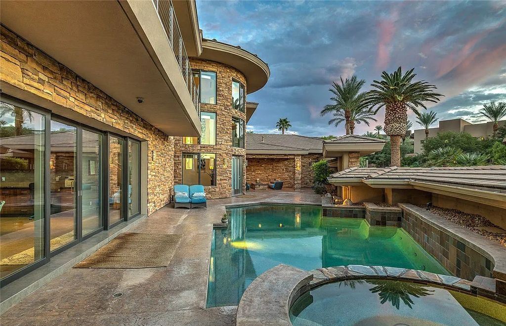 The Home in Henderson, an entirely custom & contemporary home offers views from every room, private courtyard with pool, spa, outdoor kitchen, fire pit and built-in BBQ, dual living rooms with fireplaces, motorized shades is now available for sale. This home located at 580 Saint Croix St, Henderson, Nevada