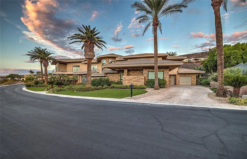 The Home in Henderson, an entirely custom & contemporary home offers views from every room, private courtyard with pool, spa, outdoor kitchen, fire pit and built-in BBQ, dual living rooms with fireplaces, motorized shades is now available for sale. This home located at 580 Saint Croix St, Henderson, Nevada