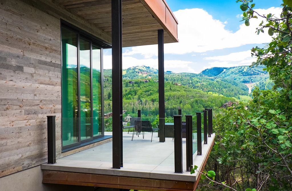 The Estate in Park City is a luxurious home full of handcrafted details, contemporary finishes, top-of-the-line appliances, and the latest in smart home systems now available for sale. This home located at 915 Mellow Mtn, Park City, Utah; offering 05 bedrooms and 07 bathrooms with 6,632 square feet of living spaces.