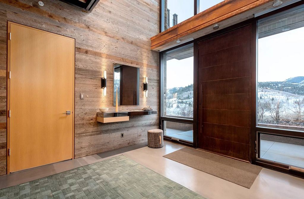 The Estate in Park City is a luxurious home full of handcrafted details, contemporary finishes, top-of-the-line appliances, and the latest in smart home systems now available for sale. This home located at 915 Mellow Mtn, Park City, Utah; offering 05 bedrooms and 07 bathrooms with 6,632 square feet of living spaces.