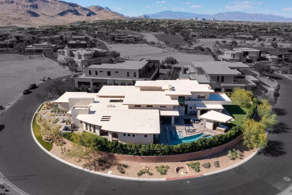 The Home in Las Vegas, an exceptional property boasts the pinnacle of luxury living with amazing entertaining features including resort-style backyard, pool & spa, elevator, kitchen pavilion, fire table, & an expansive turf area and more is now available for sale. This home located at 16 Flying Cloud Ln, Las Vegas, Nevada