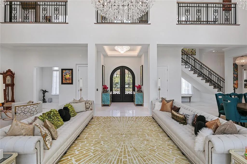 The Home in Orlando, a Spanish style residence nestled within the private residential community of Golden Oak with resort features including an expansive chef’s kitchen, Four Seasons catering kitchen, elevator, 3-car garage and two flex rooms is now available for sale. This home located at 10285 Summer Meadow Way, Orlando, Florida