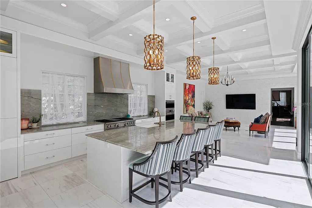 The Home in Orlando, a Spanish style residence nestled within the private residential community of Golden Oak with resort features including an expansive chef’s kitchen, Four Seasons catering kitchen, elevator, 3-car garage and two flex rooms is now available for sale. This home located at 10285 Summer Meadow Way, Orlando, Florida