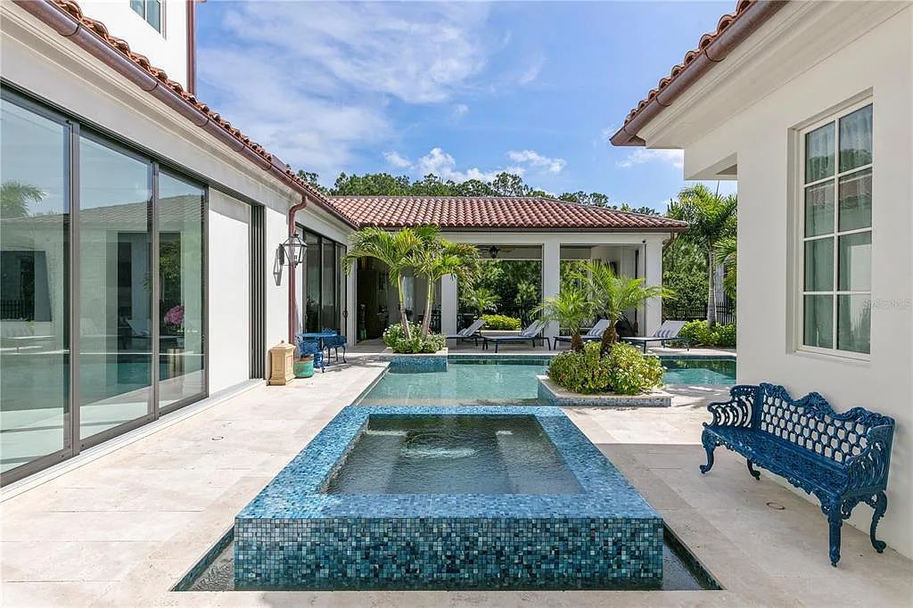 The Home in Orlando, a Spanish style residence nestled within the private residential community of Golden Oak with resort features including an expansive chef’s kitchen, Four Seasons catering kitchen, elevator, 3-car garage and two flex rooms is now available for sale. This home located at 10285 Summer Meadow Way, Orlando, Florida