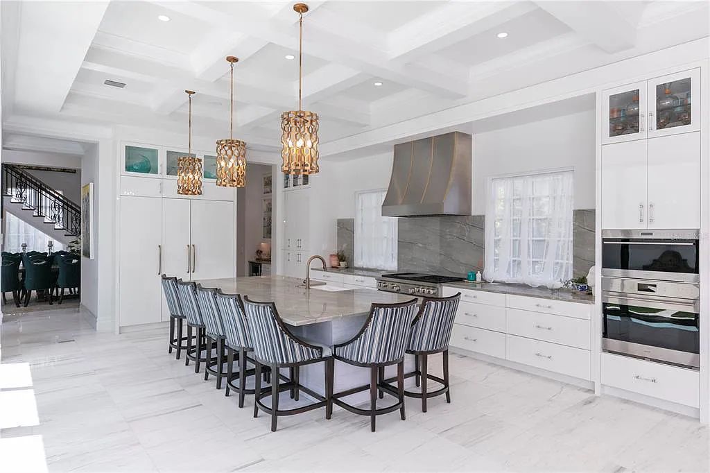 The Home in Orlando, a Spanish style residence nestled within the private residential community of Golden Oak with resort features including an expansive chef’s kitchen, Four Seasons catering kitchen, elevator, 3-car garage and two flex rooms is now available for sale. This home located at 10285 Summer Meadow Way, Orlando, Florida