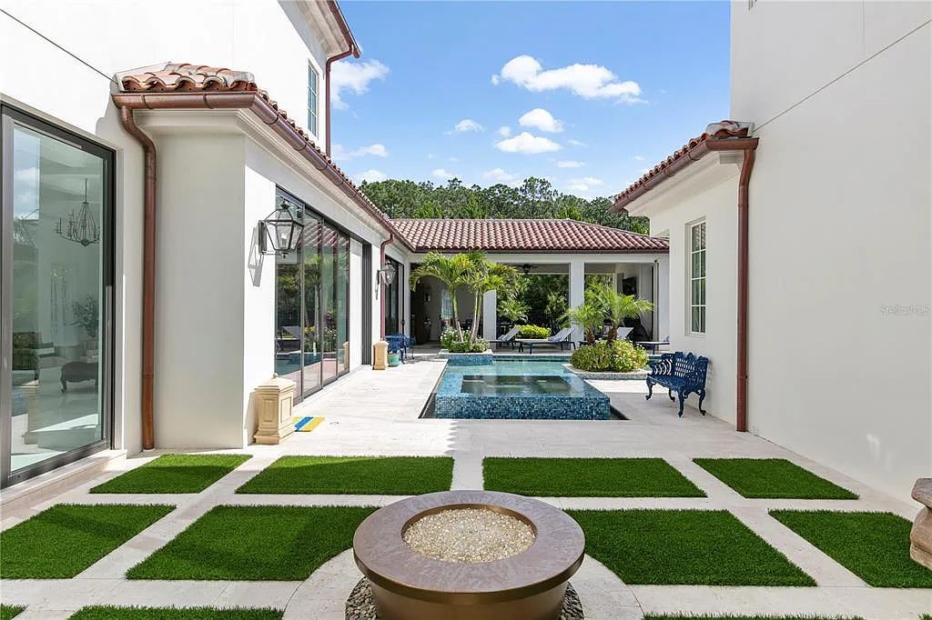 The Home in Orlando, a Spanish style residence nestled within the private residential community of Golden Oak with resort features including an expansive chef’s kitchen, Four Seasons catering kitchen, elevator, 3-car garage and two flex rooms is now available for sale. This home located at 10285 Summer Meadow Way, Orlando, Florida